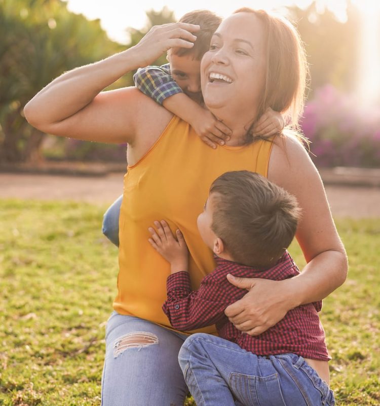 happy-latin-mother-having-playful-time-with-twin-s